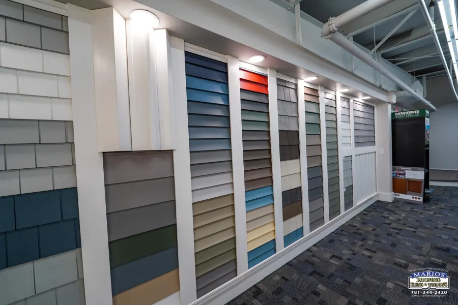 Wall of siding color and style samples in the Marios showroom
